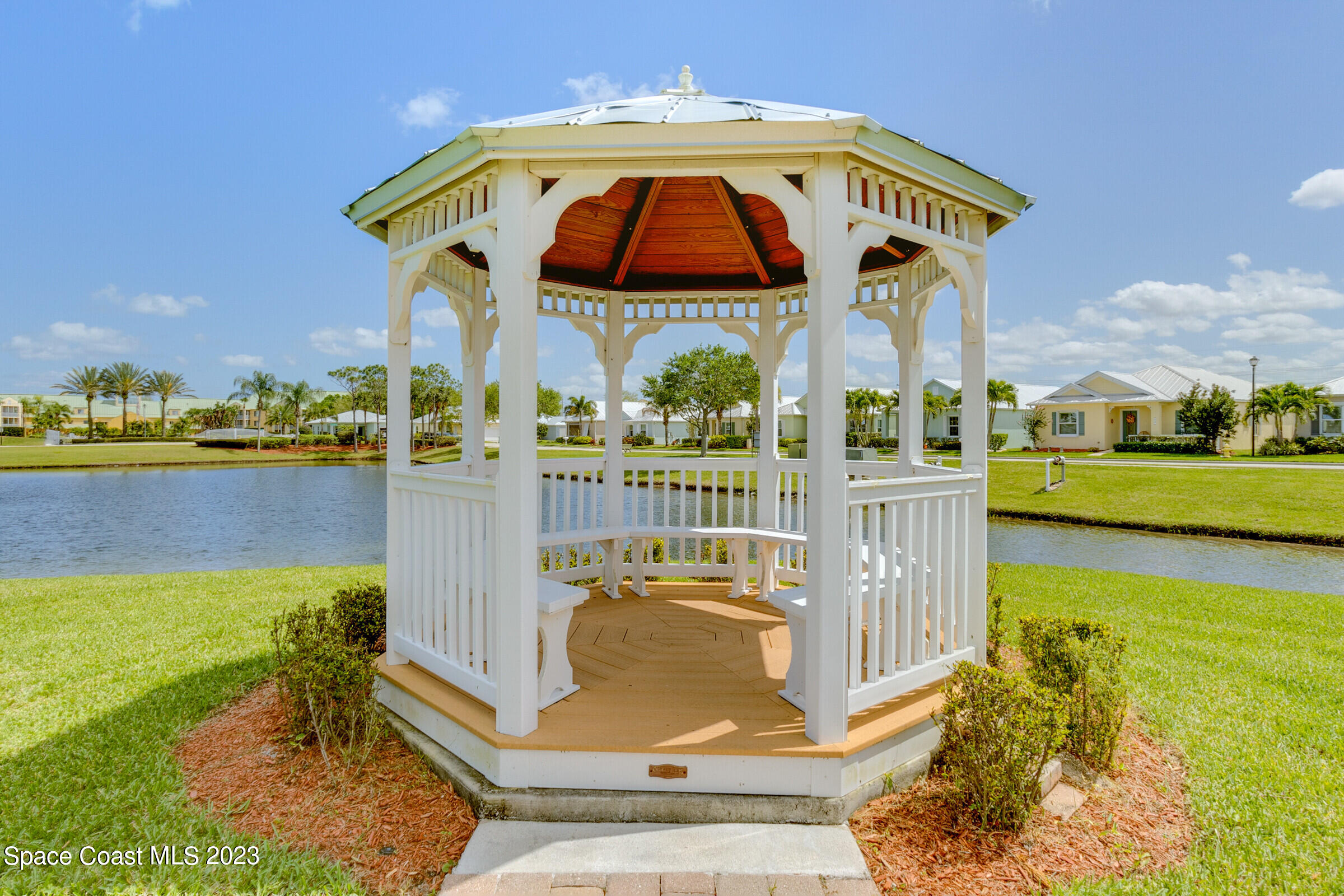4100 Alamanda Key Drive Melbourne, FL 32901 - Photo 39 of 73 a view of a swimming pool with a lounge chairs