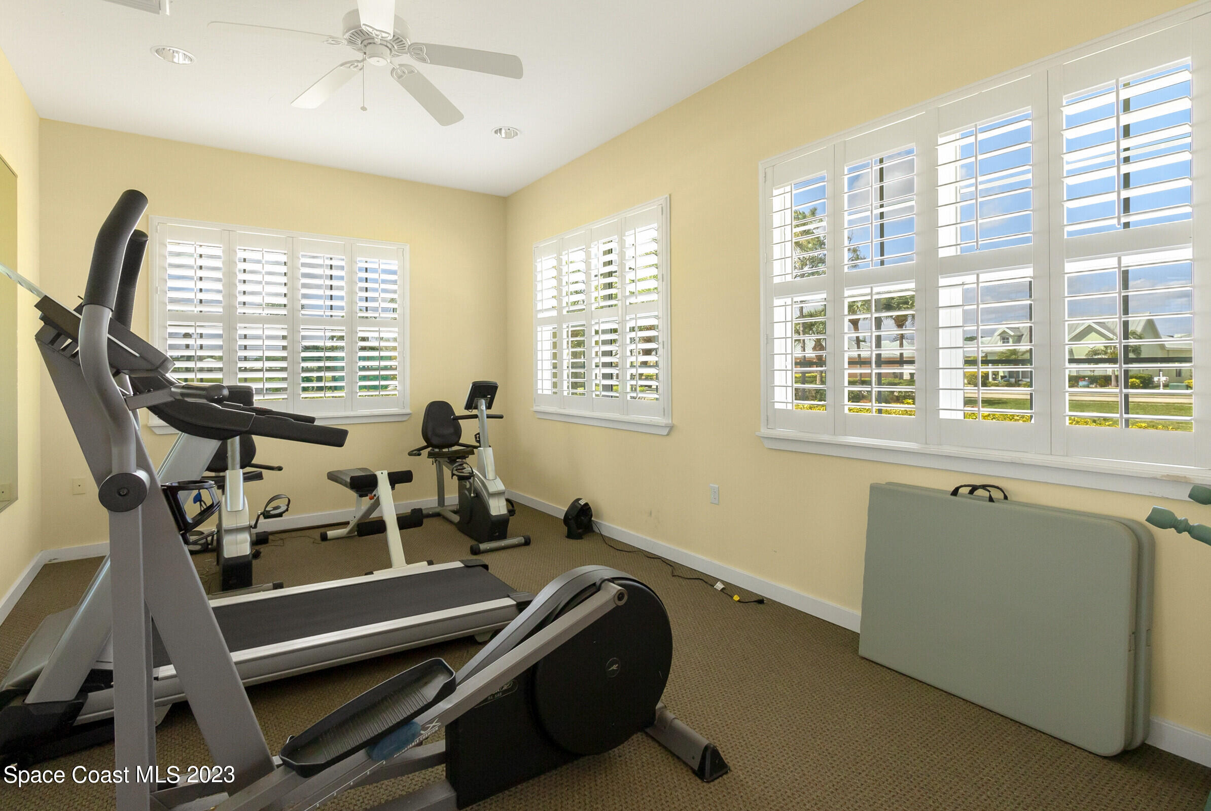 4100 Alamanda Key Drive Melbourne, FL 32901 - Photo 40 of 73 a room with gym equipment and windows