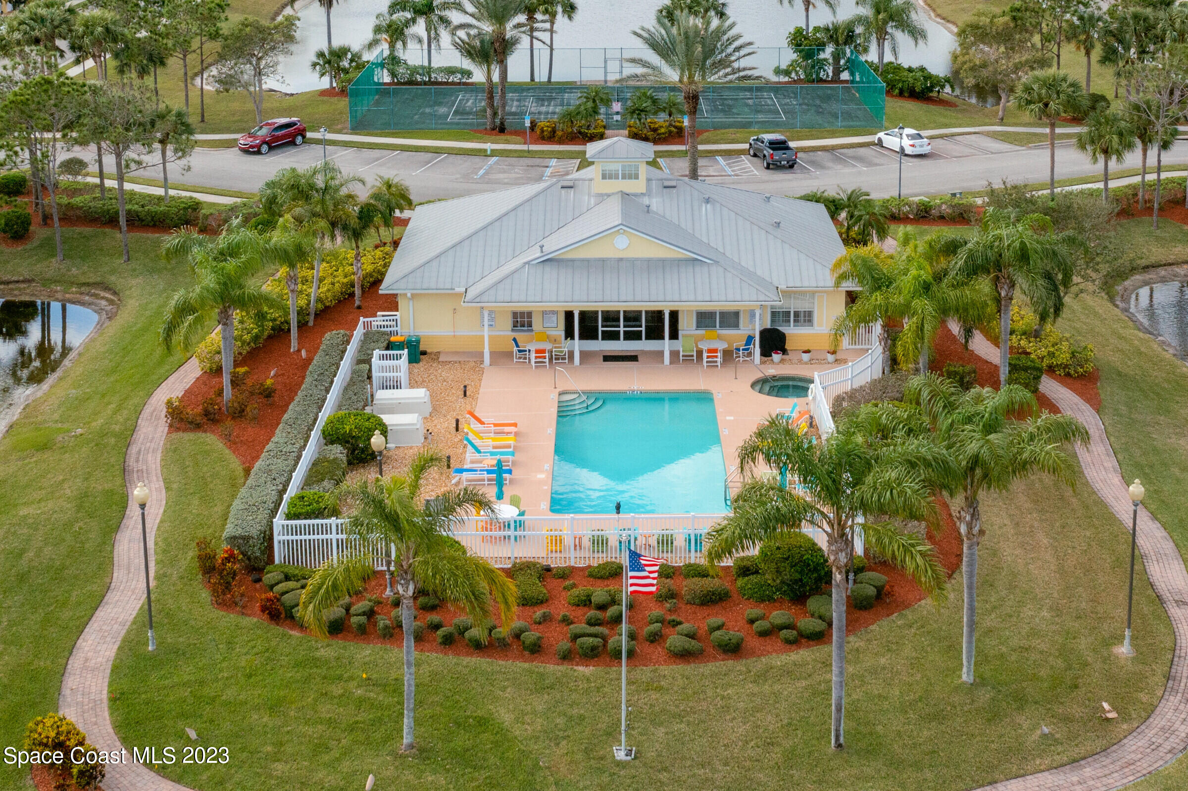 4100 Alamanda Key Drive Melbourne, FL 32901 - Photo 45 of 73 an aerial view of a house with a garden and lake view