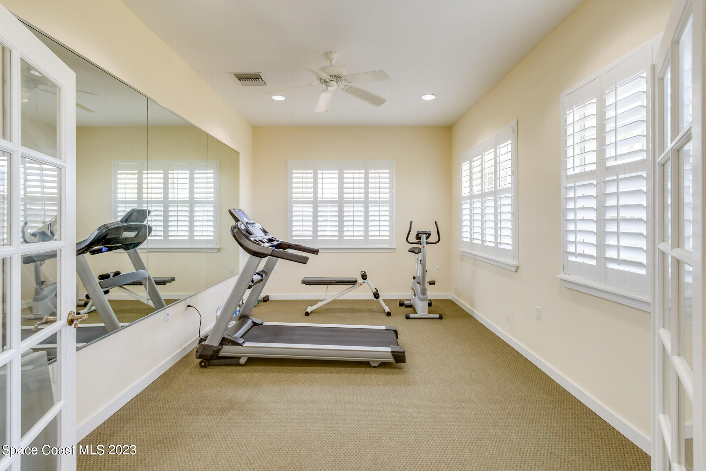 4100 Alamanda Key Drive Melbourne, FL 32901 - Photo 68 of 73 a room with gym equipment and a large window