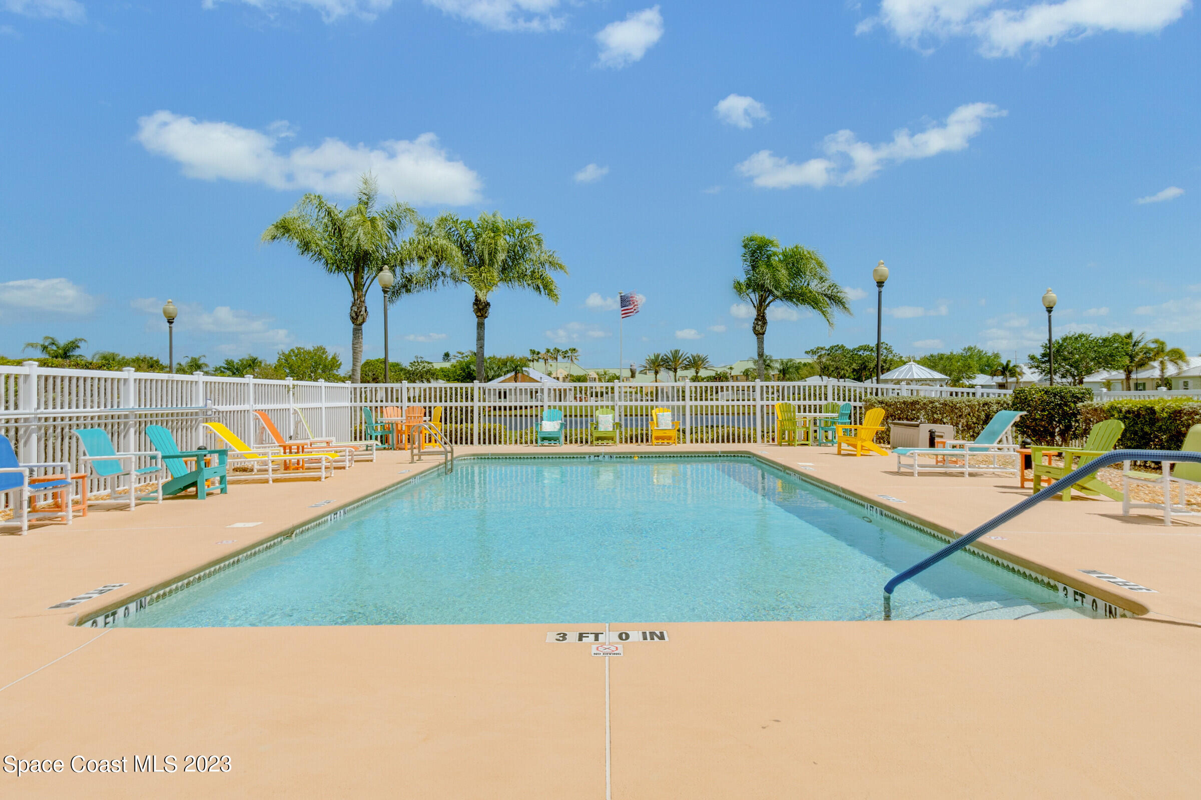 4100 Alamanda Key Drive Melbourne, FL 32901 - Photo 70 of 73 a view of a swimming pool with an outdoor seating