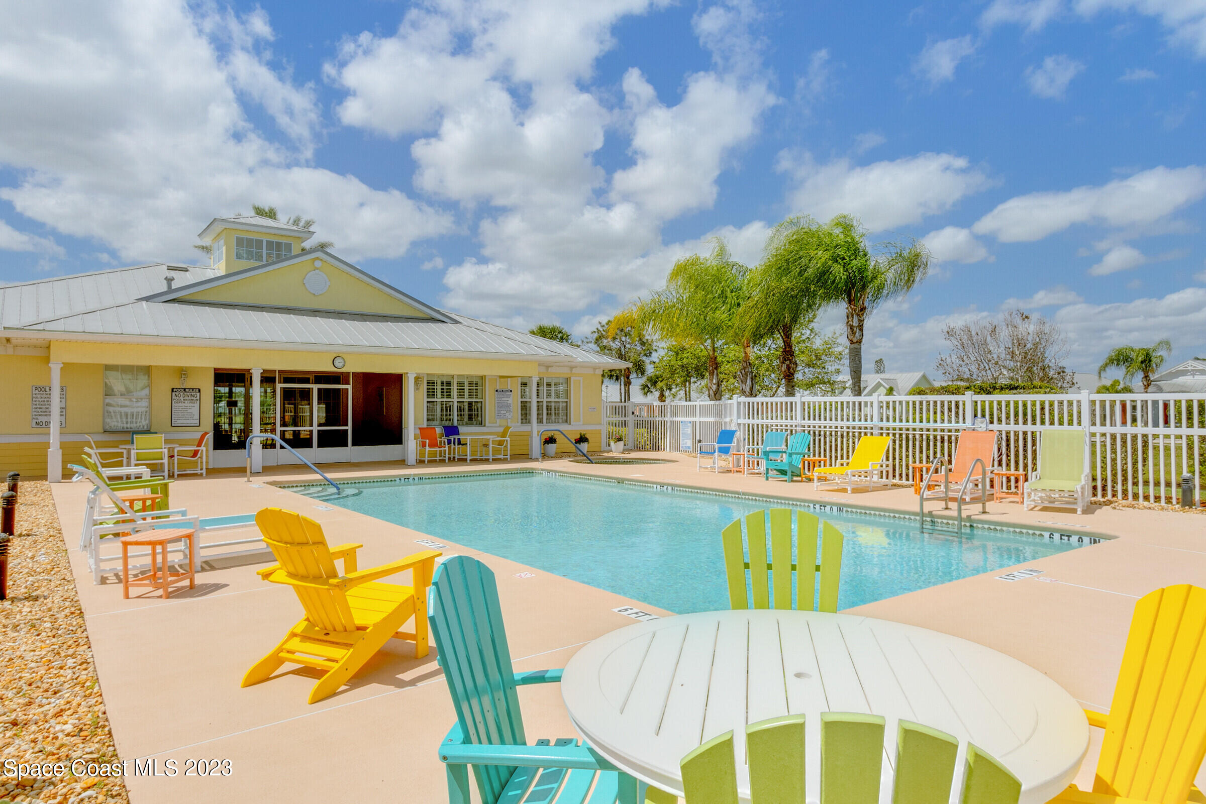 4100 Alamanda Key Drive Melbourne, FL 32901 - Photo 71 of 73 a view of a swimming pool with a lounge chairs