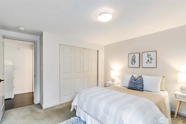 a bedroom with a bed and a walk in closet