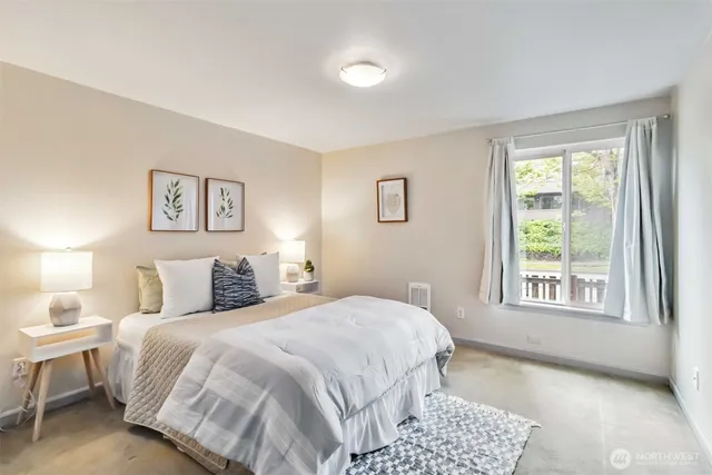 a bedroom with a bed and a window