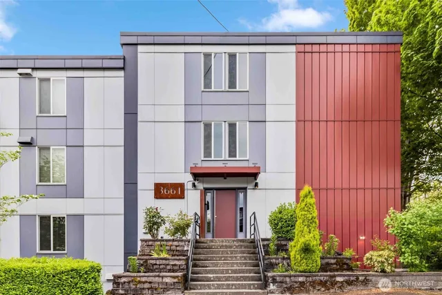 a view of building with potted plants