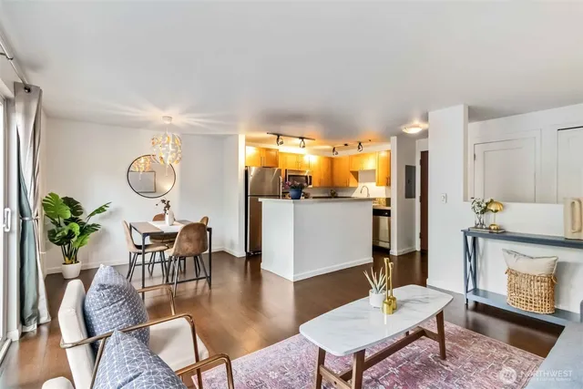 a living room with fireplace furniture and a table