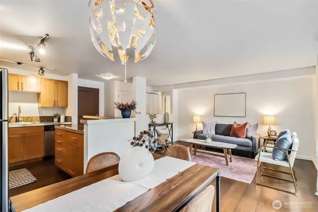 a living room with furniture and a chandelier