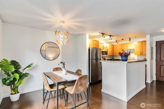 a dining room with furniture and wooden floor