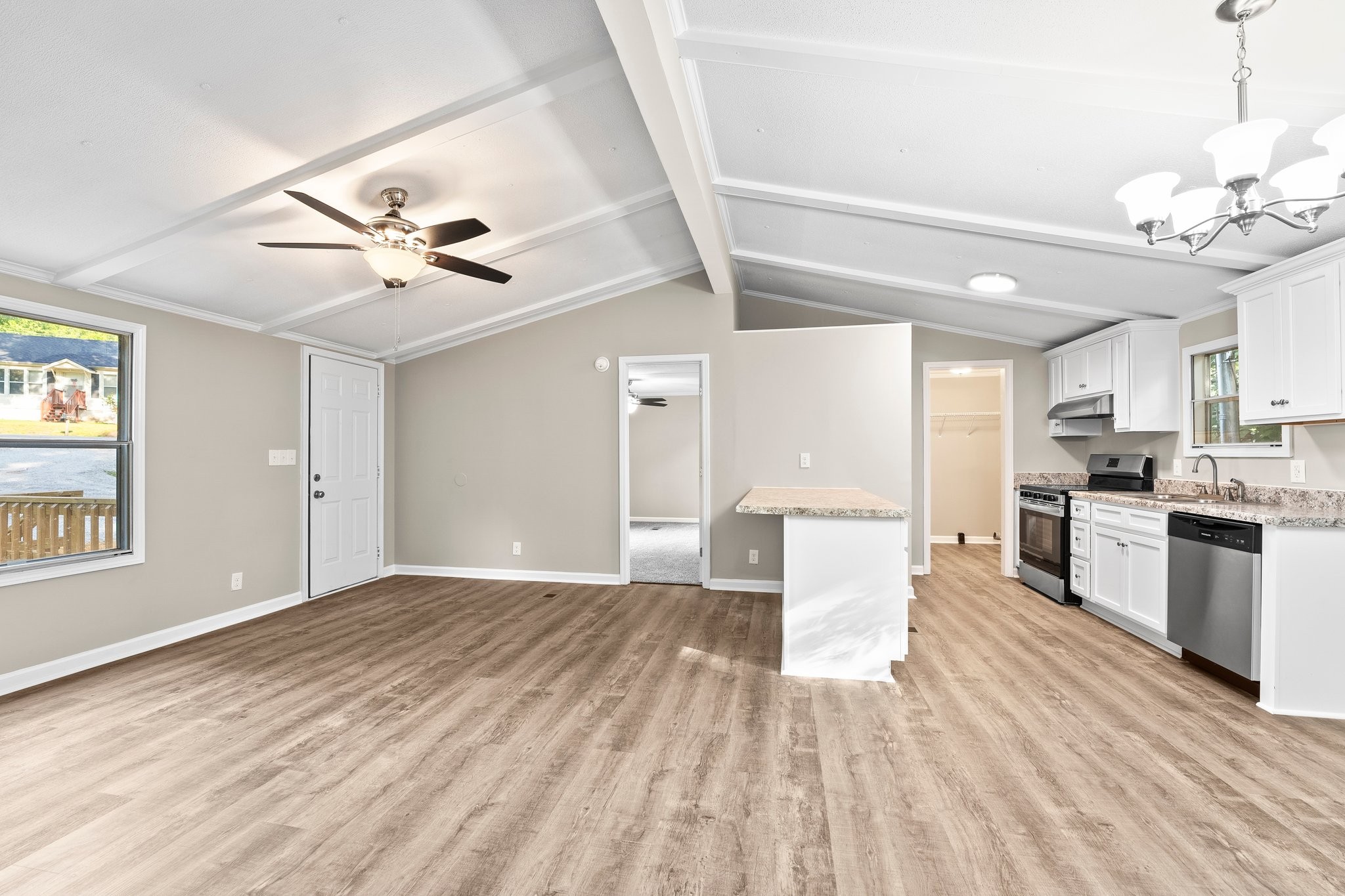 148 Glenburg Drive Manchester, TN 37355 - Photo 14 of 36 a view of a kitchen with a sink dishwasher a kitchen view with wooden floor and cabinets