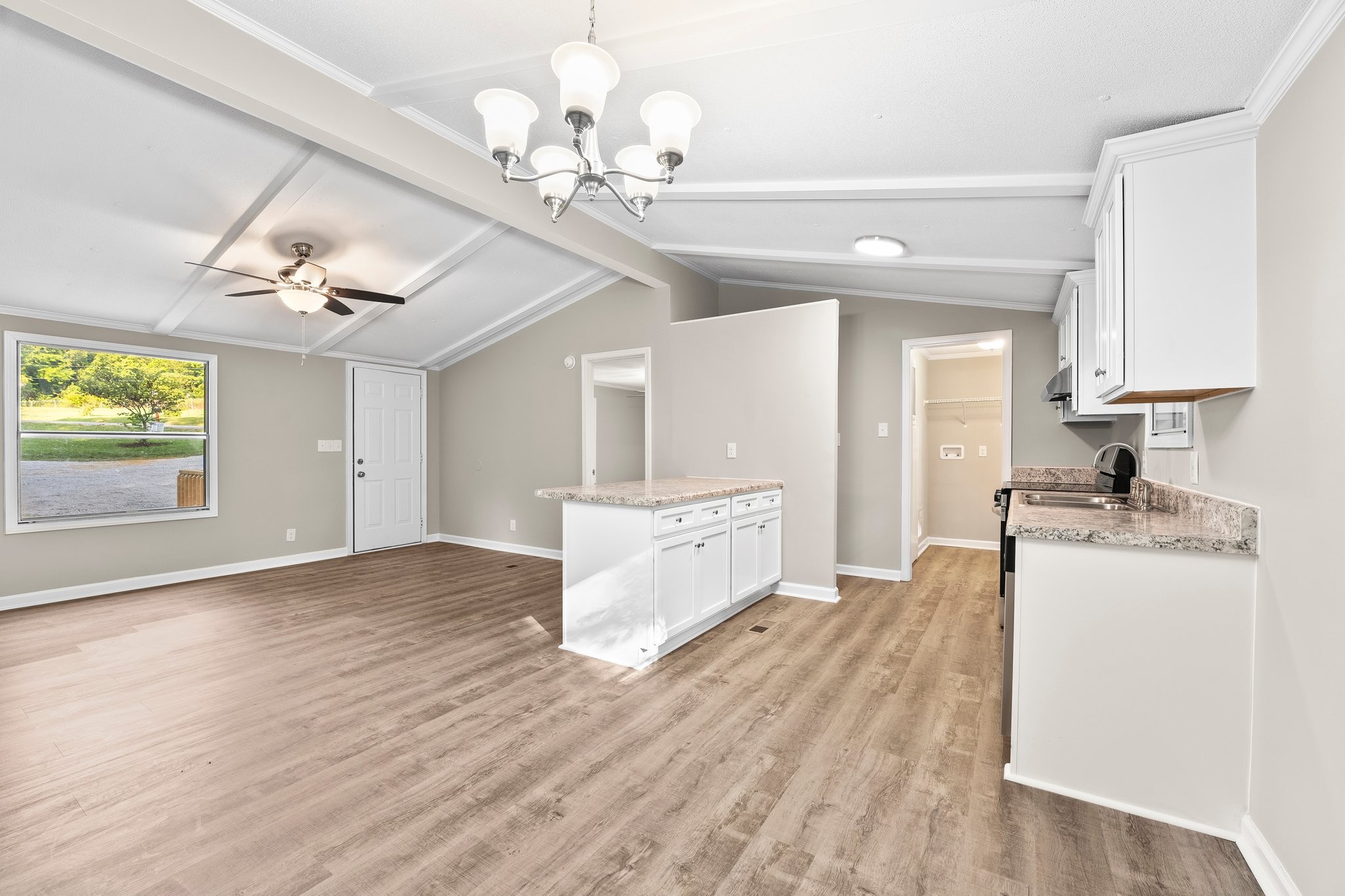 148 Glenburg Drive Manchester, TN 37355 - Photo 17 of 36 a large kitchen with kitchen island a large counter space a sink appliances and cabinets