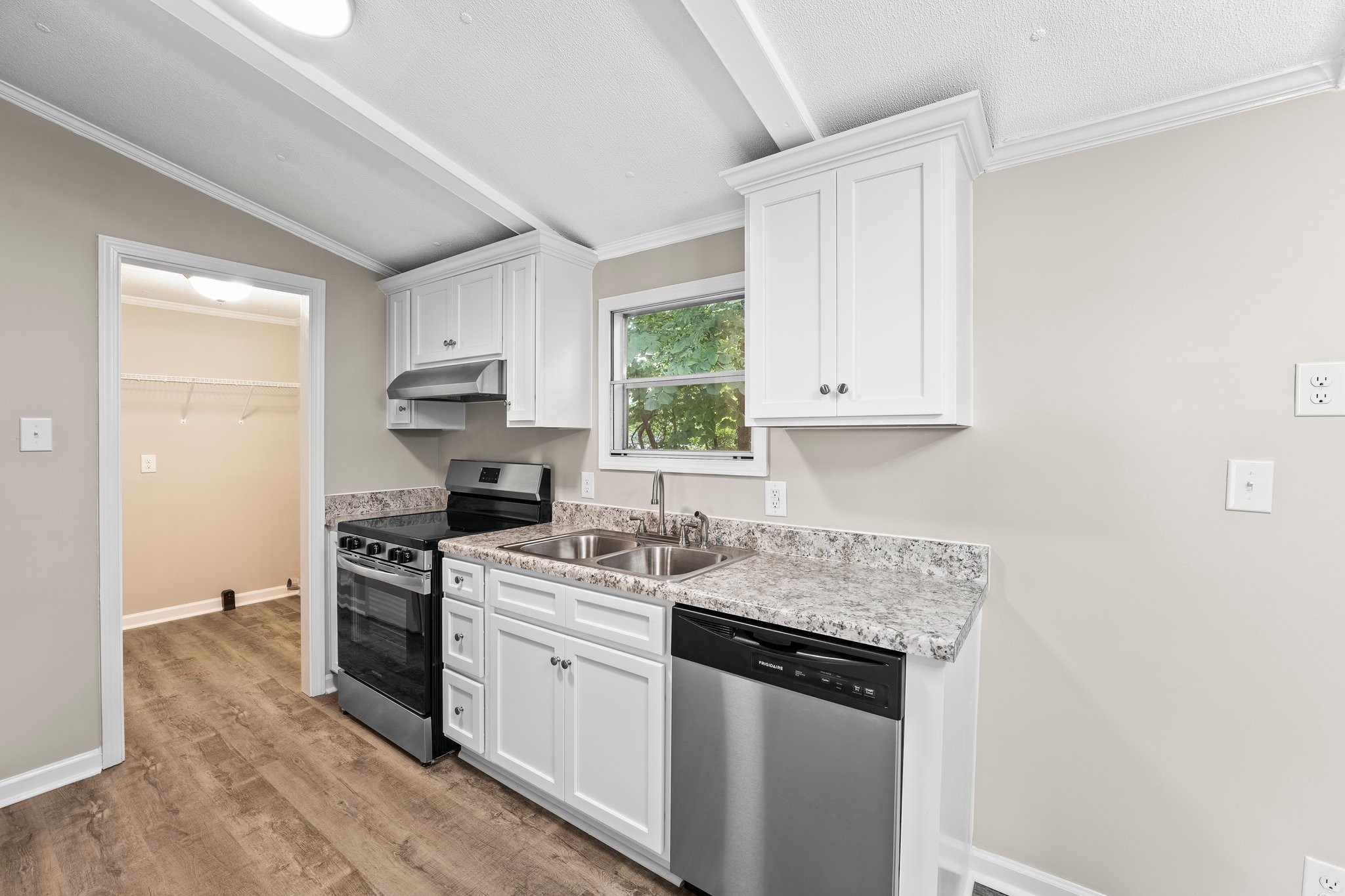 148 Glenburg Drive Manchester, TN 37355 - Photo 18 of 36 a kitchen with a sink stove and cabinets