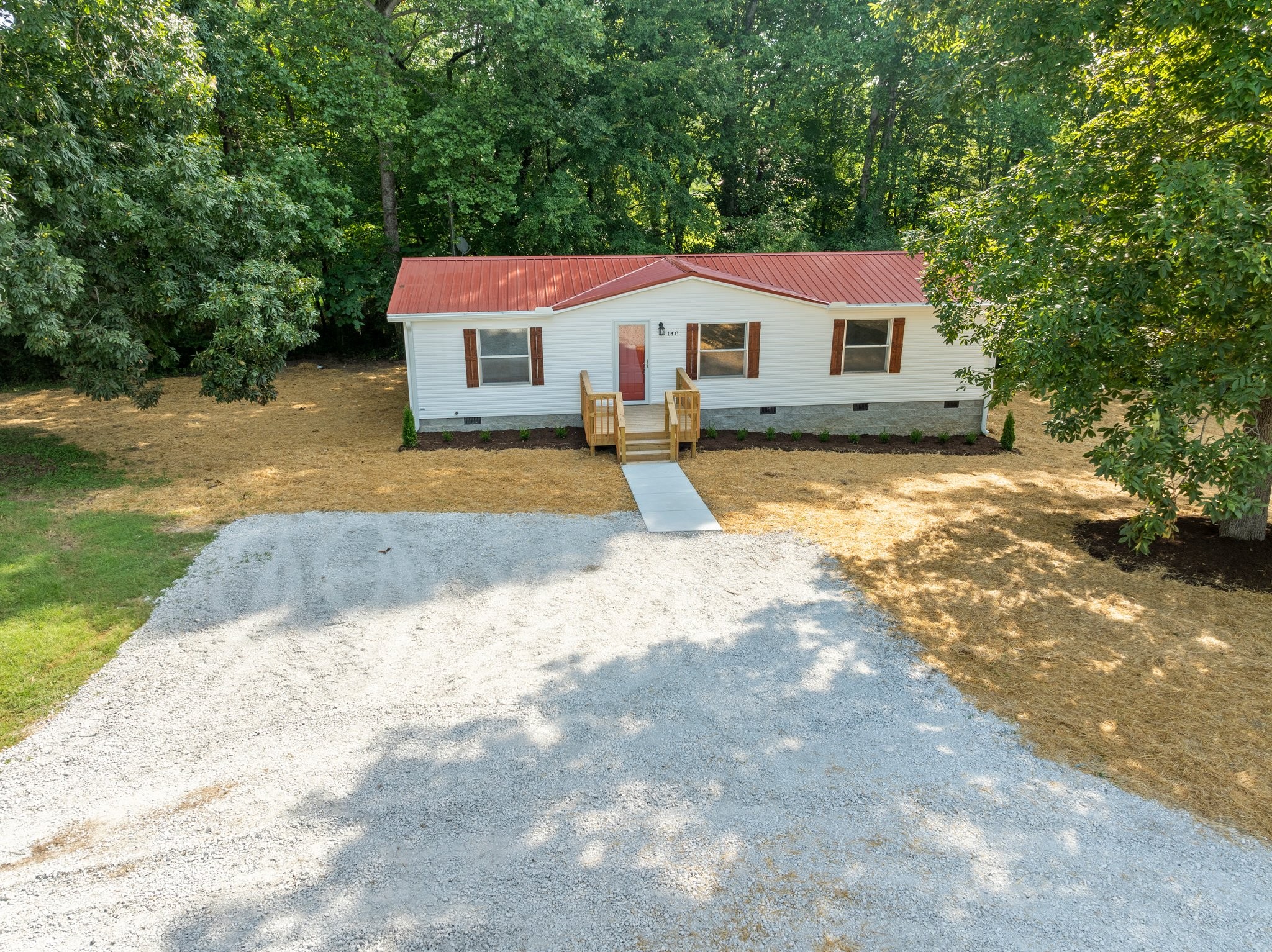 148 Glenburg Drive Manchester, TN 37355 - Photo 2 of 36 a front view of a house with a yard