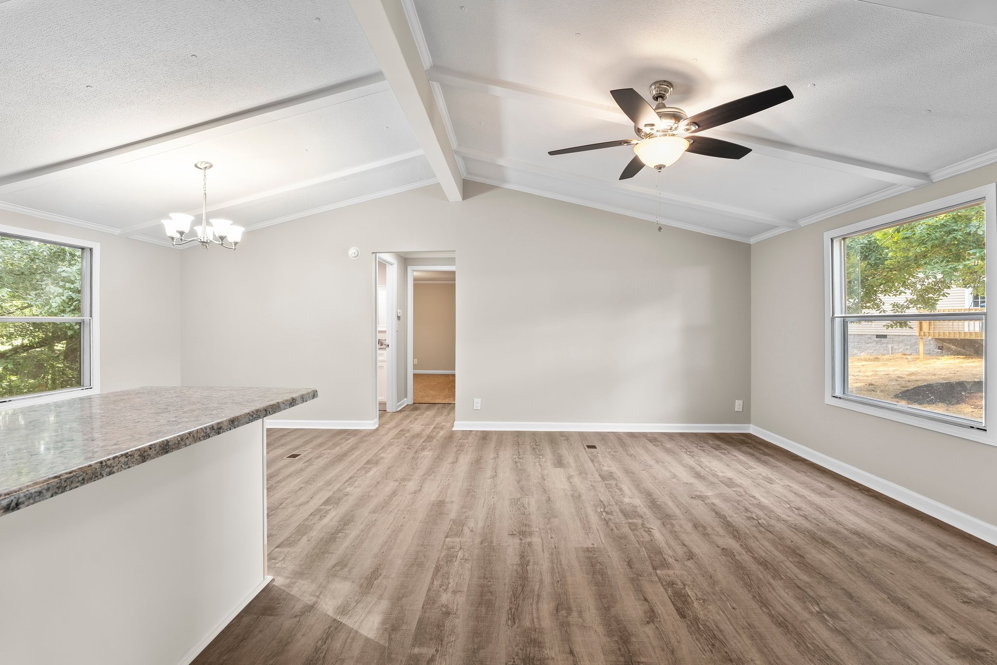 148 Glenburg Drive Manchester, TN 37355 - Photo 21 of 36 a view of an empty room with wooden floor and a window