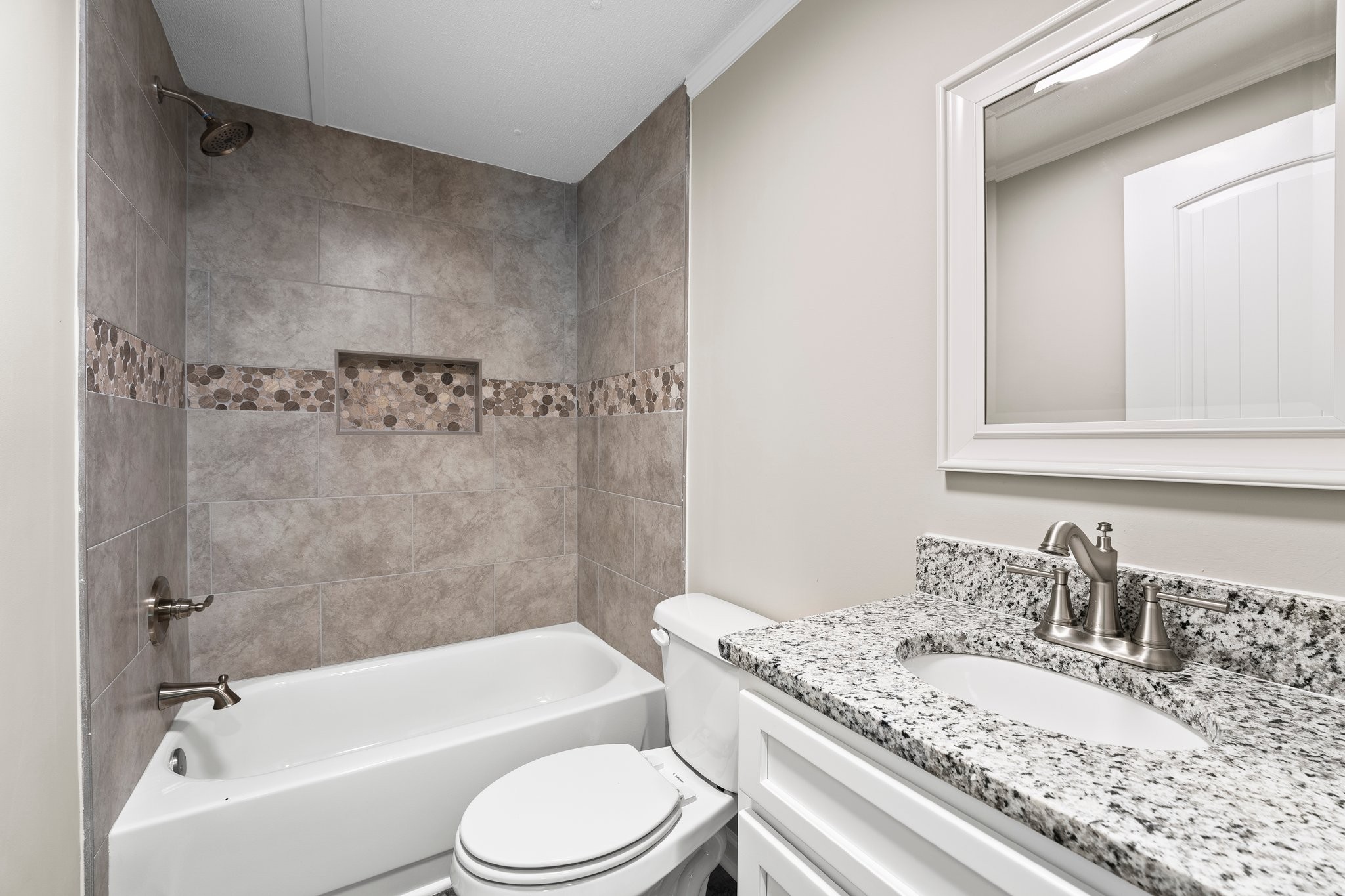 148 Glenburg Drive Manchester, TN 37355 - Photo 32 of 36 a bathroom with a granite countertop bathtub shower sink vanity mirror and toilet