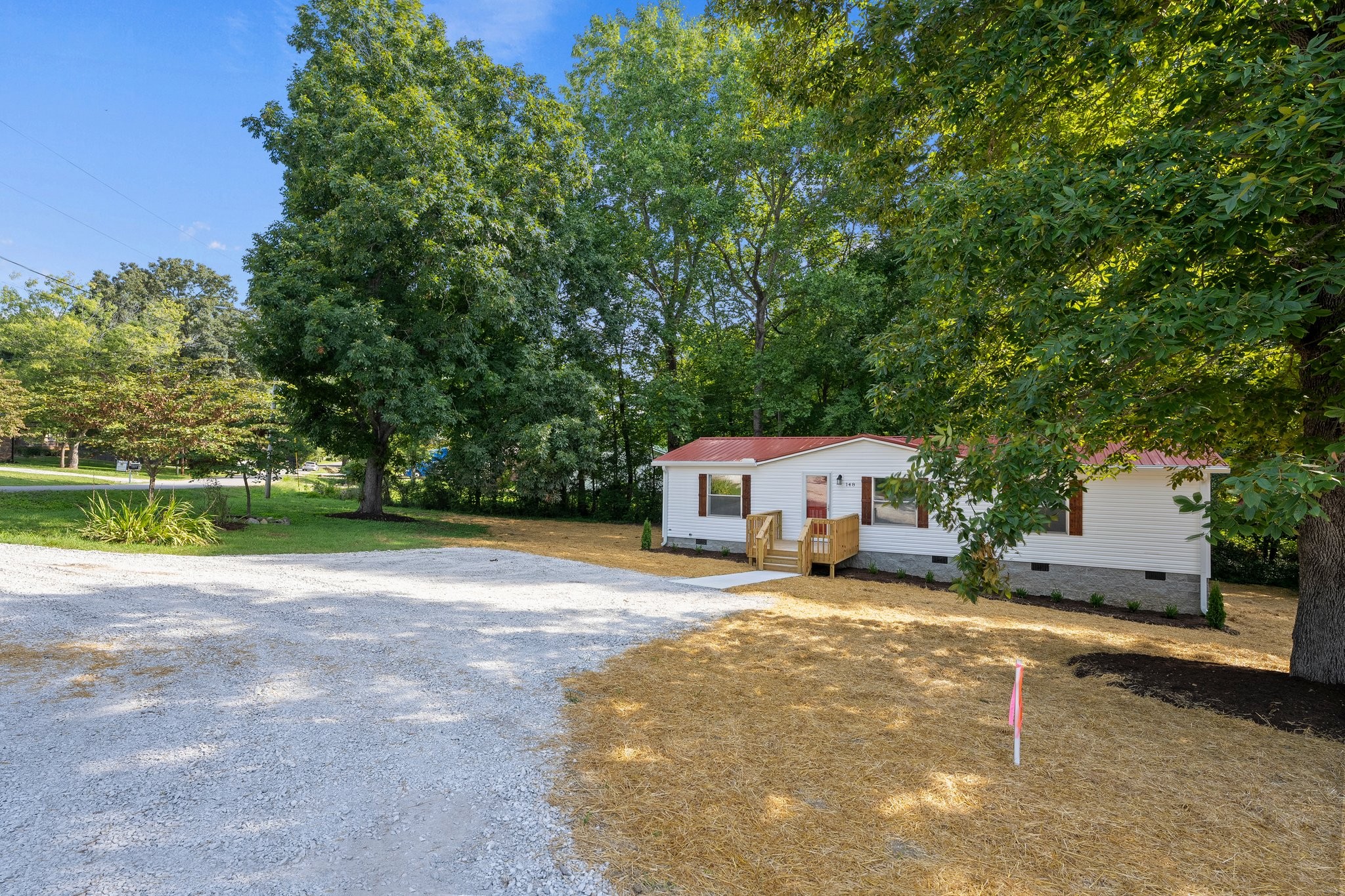 148 Glenburg Drive Manchester, TN 37355 - Photo 4 of 36 a view of a house with a big yard and large trees