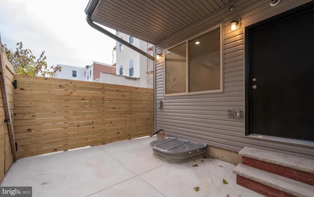a view of kitchen with kitchen island wooden floor and center island