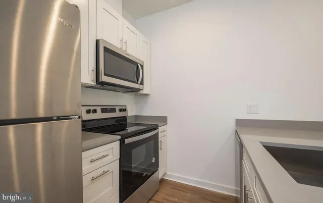 a view of room with window and hardwood floor