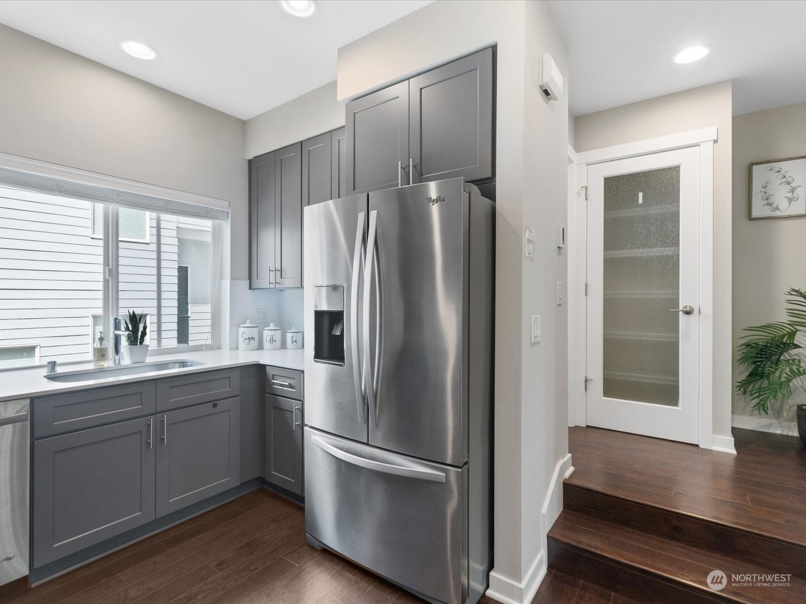 19225 Damson Road, Unit R2 Lynnwood, WA 98036 - Photo 18 of 37 a kitchen with stainless steel appliances a refrigerator sink and cabinets