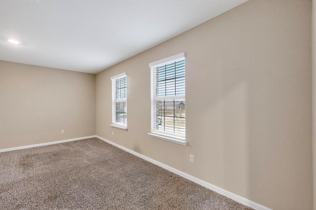 305 Honeysuckle Lane Princeton, TX 75407 - Photo 27 of 39 a view of an empty room with a window