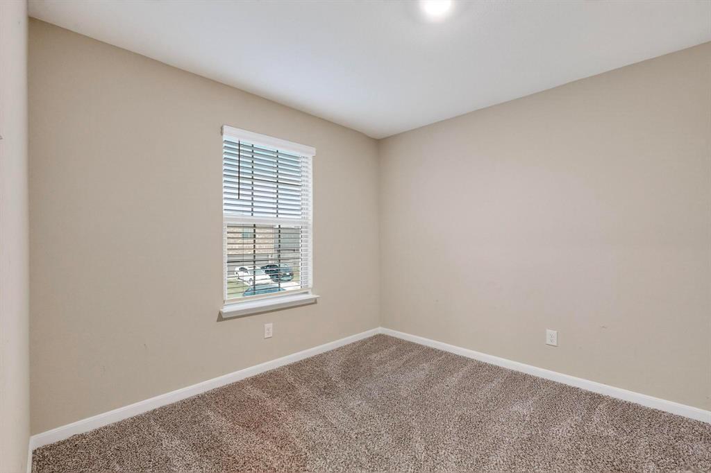305 Honeysuckle Lane Princeton, TX 75407 - Photo 30 of 39 an empty room with windows