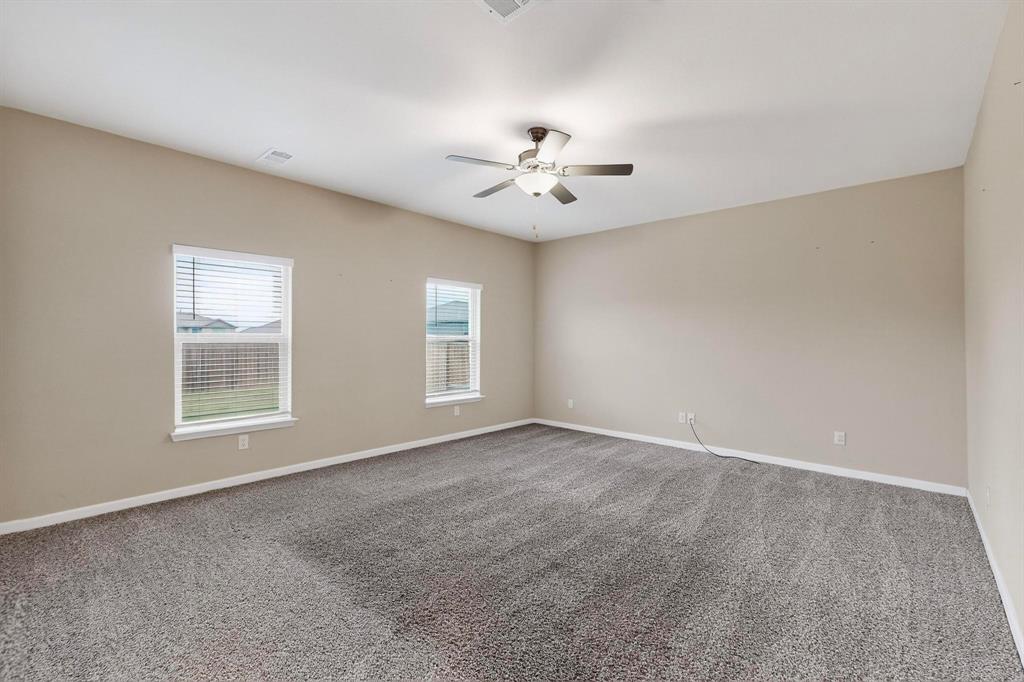305 Honeysuckle Lane Princeton, TX 75407 - Photo 8 of 39 a view of an empty room with a window