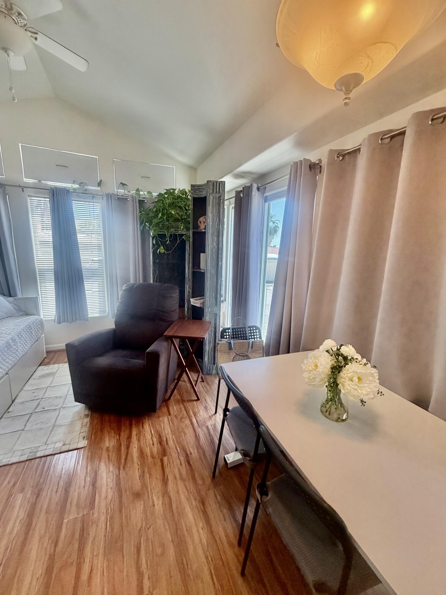 74711 Dillon Road, Unit 264 Desert Hot Springs, CA 92241 - Photo 13 of 21 a living room with furniture and a wooden floor