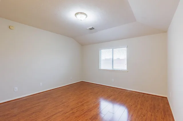 a bathroom with a shower and a sink