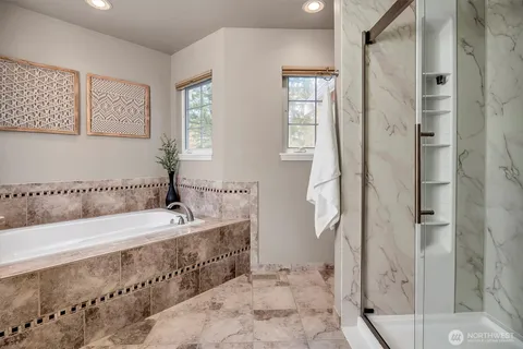 a bathroom with a bathtub and a sink