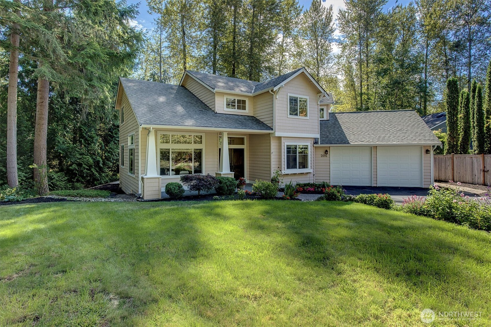 2016 236th Avenue Southeast Sammamish, WA 98075 - Photo 25 of 25 a front view of a house with a garden and yard