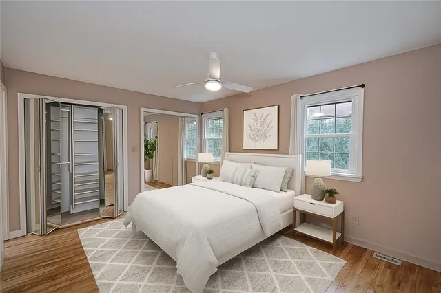 a bedroom with a large bed and a window