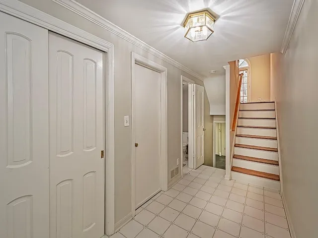 a view of an entryway with wooden floor
