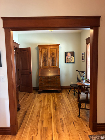 581 South 700 East Spring City, UT 84662 - Photo 11 of 42 Hardwood flooring throughout, wide framed doorway with substantial trim, solid wood paneled door, and wood baseboards