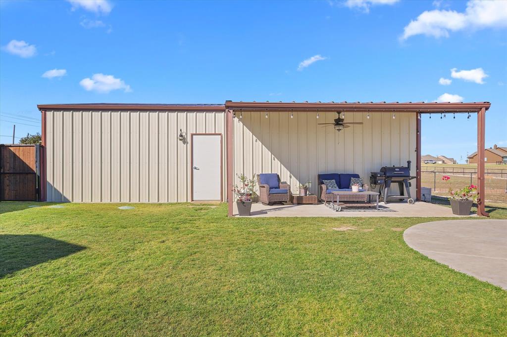 2375 County Road 4010 Decatur, TX 76234 - Photo 21 of 34 View of outdoor structure with an outdoor hangout area