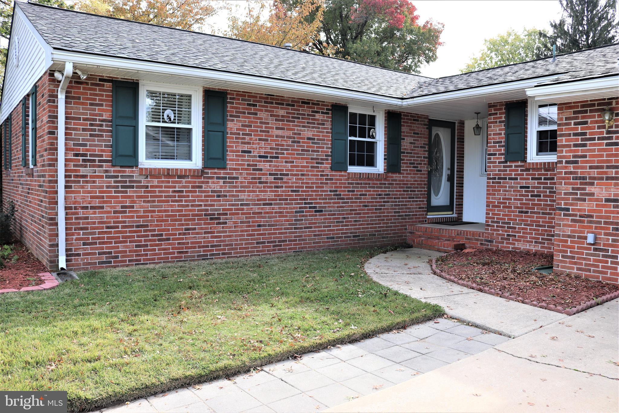 29 Georgia Road Pennsville, NJ 08070 - Photo 5 of 29 a brick house with a yard