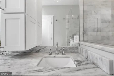 a bathroom with a bathtub and a sink