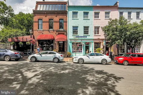 a table and chairs in front of a cafe
