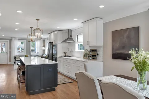 a kitchen with counter top space cabinets and appliances