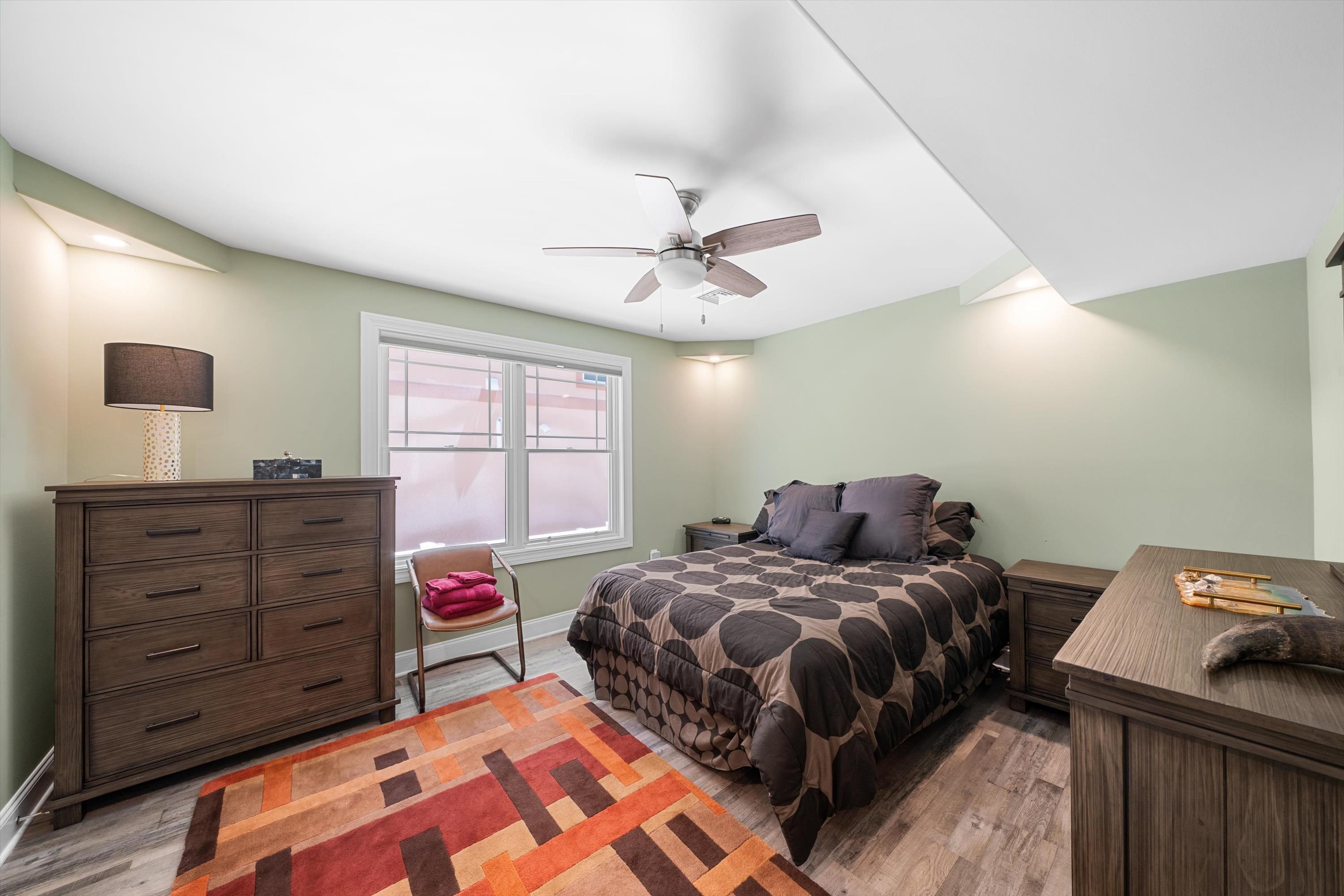 305 East Stockton Road Wildwood Crest, NJ 08260 - Photo 6 of 28 a bedroom with a bed and a window