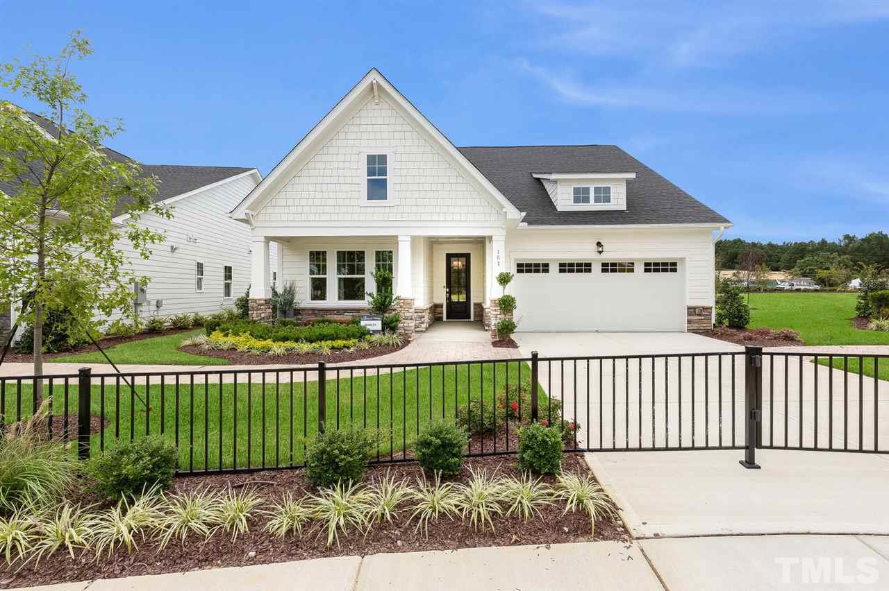 156 Ivory Lane, Unit 84 Raleigh, NC 27610 - Photo 1 of 30 a front view of a house with a garden