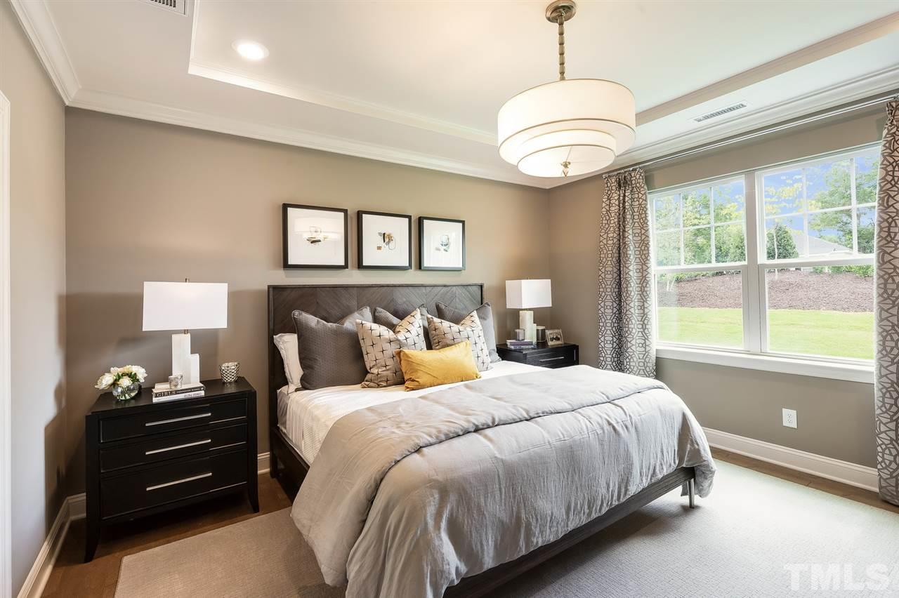 156 Ivory Lane, Unit 84 Raleigh, NC 27610 - Photo 17 of 30 a bedroom with a bed and a window