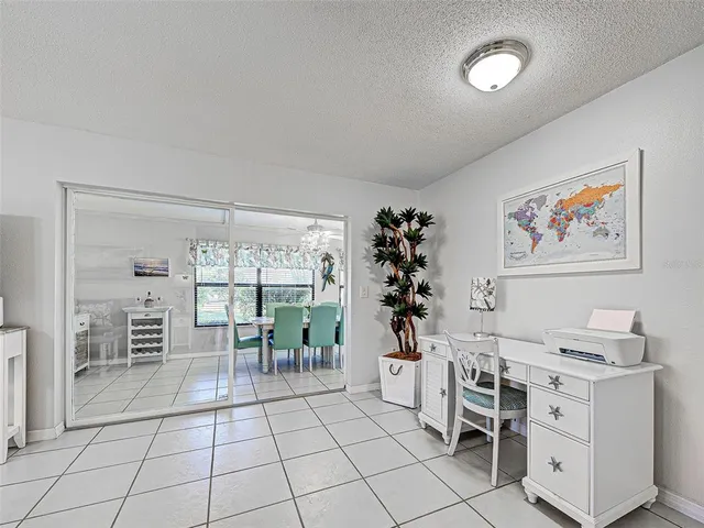 a kitchen with white cabinets stainless steel appliances and a sink