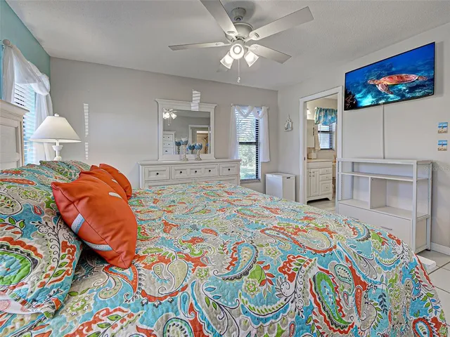 a en suite bathroom with a toilet sink and a mirror
