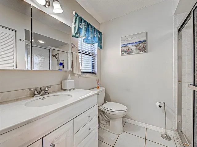 a spacious bedroom with a bed and a walk in closet