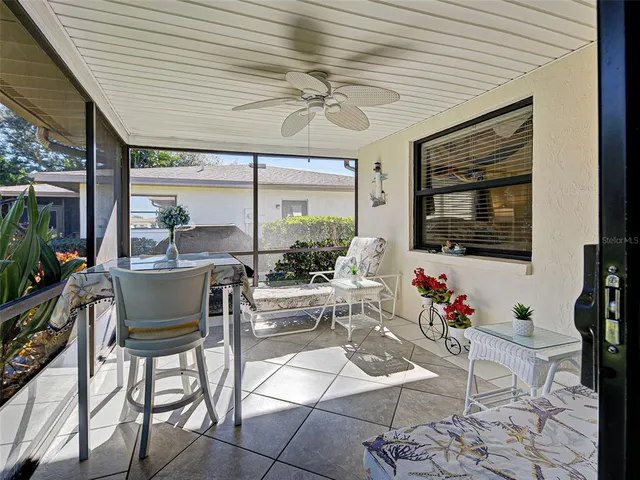 a view of swimming pool with outdoor seating and city view