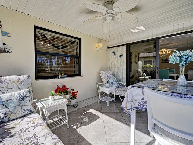 a swimming pool with outdoor seating and yard