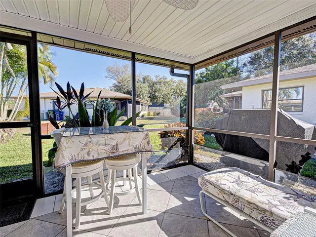 a view of swimming pool with outdoor seating and yard in the back