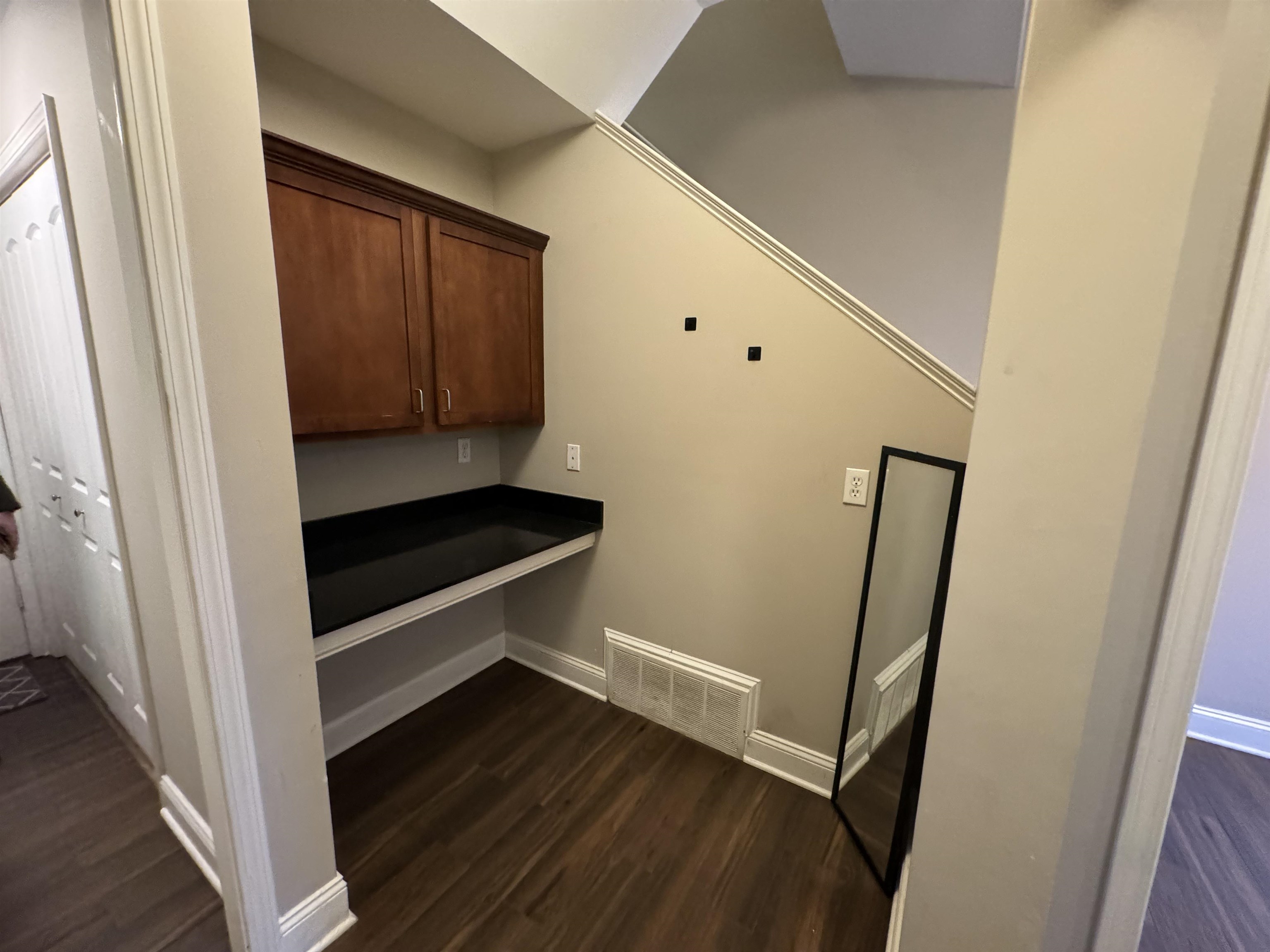 70 West Carolina Avenue, Unit 105 Memphis, TN 38103 - Photo 16 of 40 a view of a hallway with wooden floor and staircase