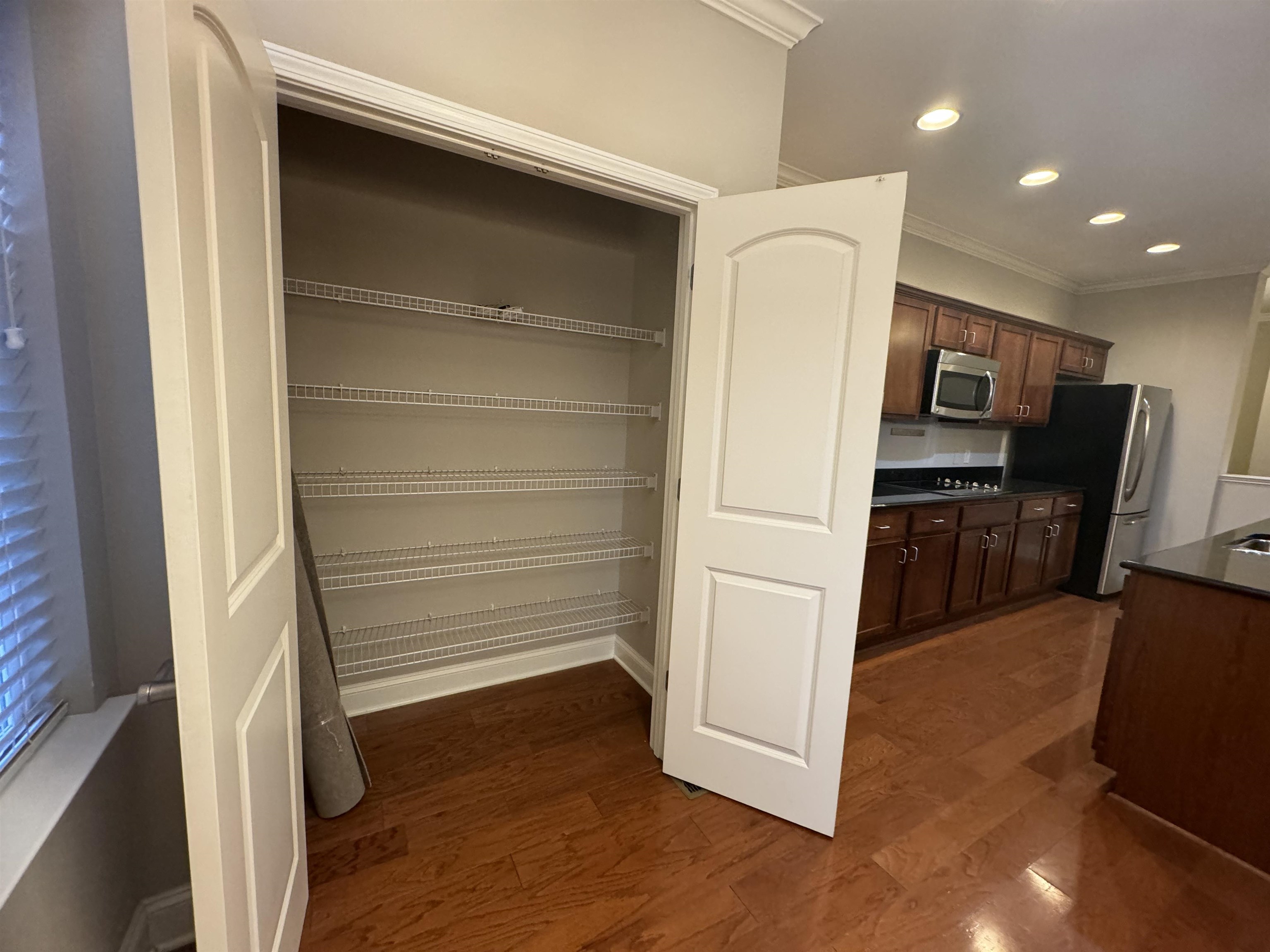 70 West Carolina Avenue, Unit 105 Memphis, TN 38103 - Photo 21 of 40 a view of a hallway with wooden floor and staircase