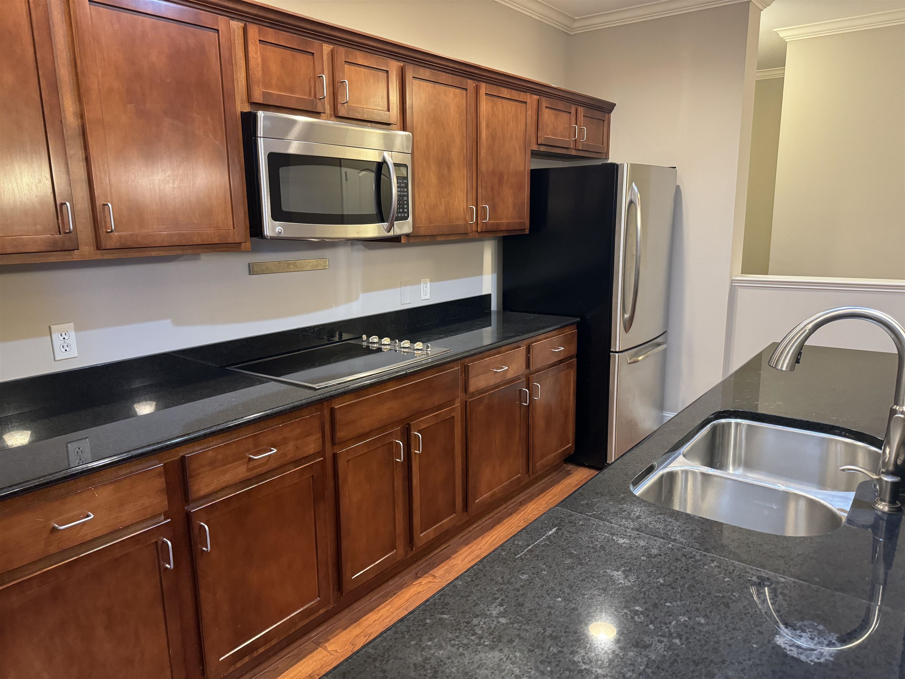 70 West Carolina Avenue, Unit 105 Memphis, TN 38103 - Photo 25 of 40 a kitchen with stainless steel appliances granite countertop a refrigerator and a sink