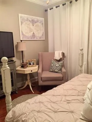a bedroom with a bed and a table